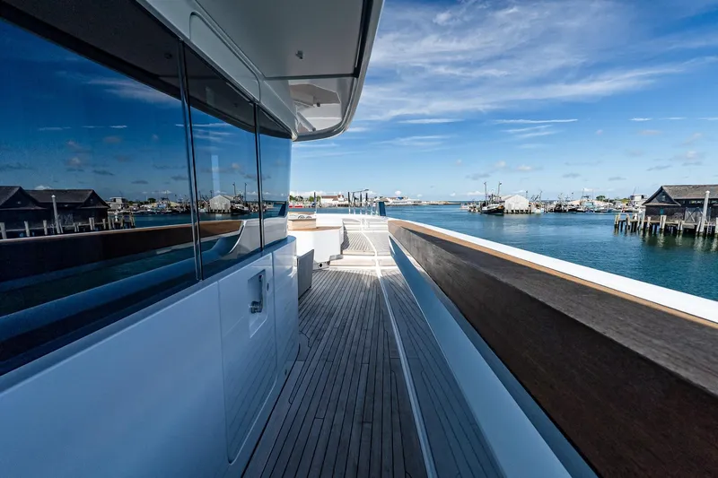 Neverland Yacht Photos Pics Luxurious Sanlorenzo 44 Alloy yacht deck, 2020 model, with scenic harbor view.