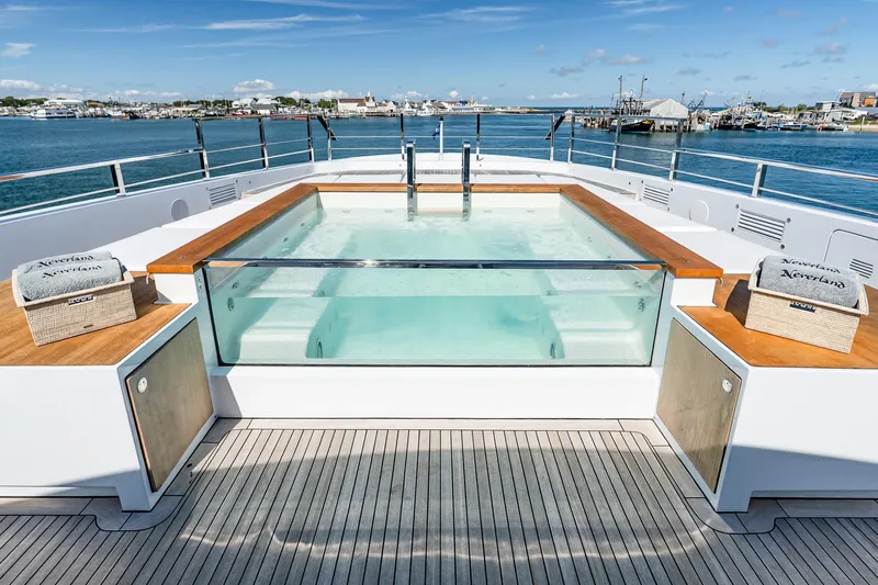 Neverland Yacht Photos Pics Luxurious 2020 Sanlorenzo 44 Alloy yacht with elegant deck jacuzzi and ocean view.