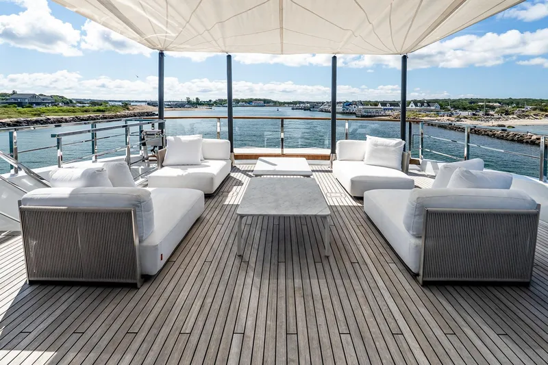 Neverland Yacht Photos Pics Luxurious Sanlorenzo 44 Alloy yacht deck with elegant seating, ocean view, and modern design.