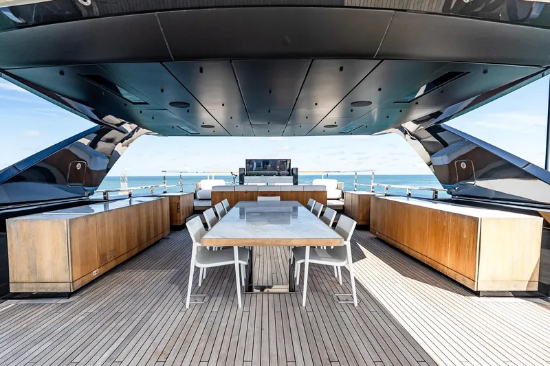 Neverland Yacht Photos Pics Luxurious 2020 Sanlorenzo 44 Alloy yacht deck with modern dining area and ocean view.