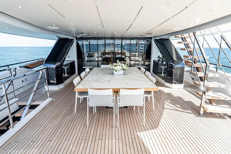 Neverland Yacht Photos Pics Luxurious 2020 Sanlorenzo 44 Alloy yacht deck with elegant dining area and ocean view.