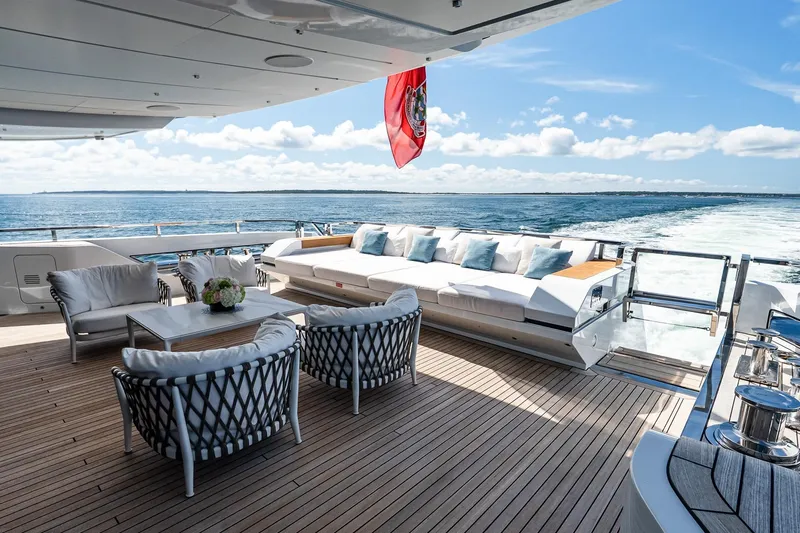 Neverland Yacht Photos Pics Luxurious Sanlorenzo 44 Alloy yacht deck with elegant seating, ocean view, and sunny skies.
