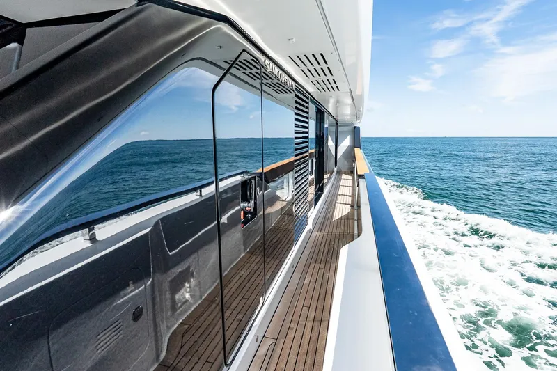 Neverland Yacht Photos Pics Sanlorenzo 44 Alloy yacht, 2020 model, cruising on open sea with sleek design and wooden deck.