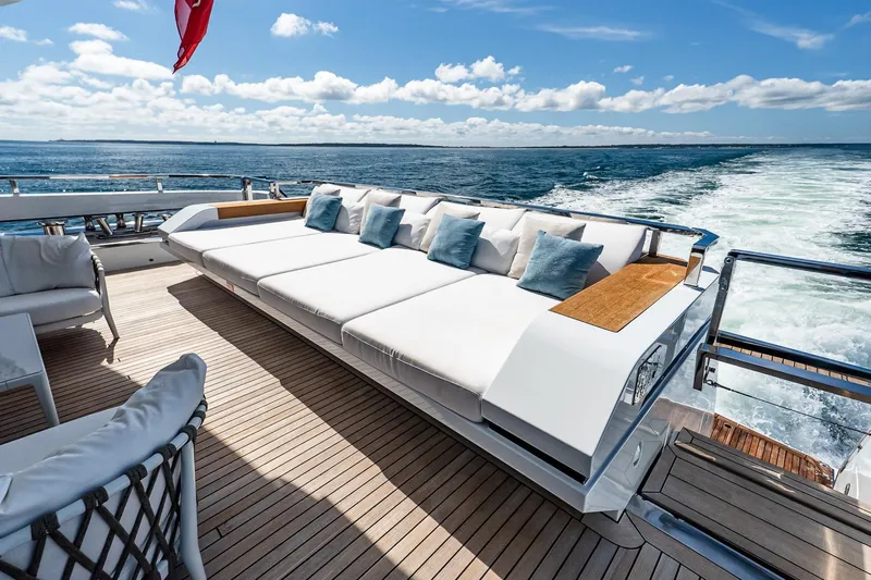 Neverland Yacht Photos Pics Luxurious Sanlorenzo 44 Alloy yacht deck with plush seating, ocean view, and sunny skies.
