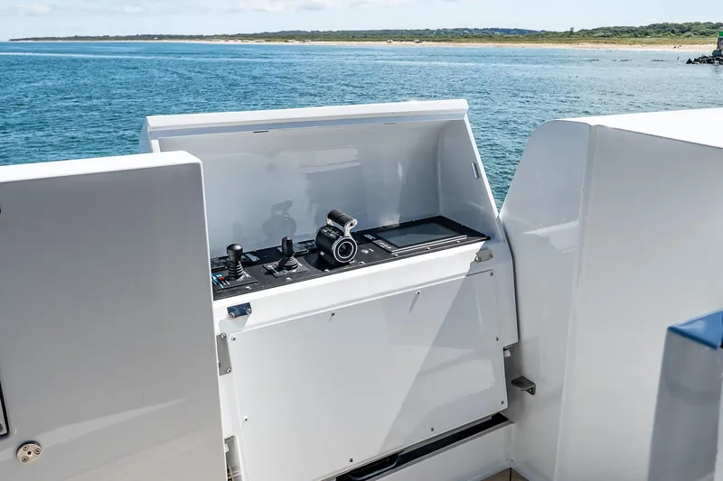 Neverland Yacht Photos Pics Control panel on 2020 Sanlorenzo 44 Alloy yacht, overlooking serene ocean view.