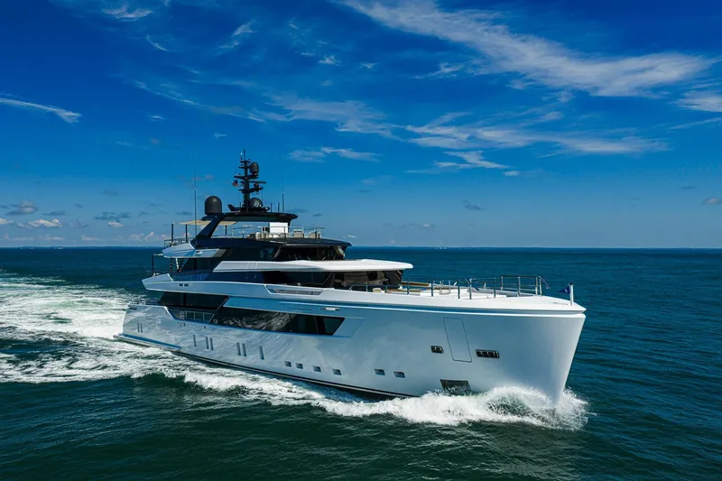 Neverland Yacht Photos Pics Luxurious 2020 Sanlorenzo 44 Alloy yacht cruising on open sea under clear blue sky.