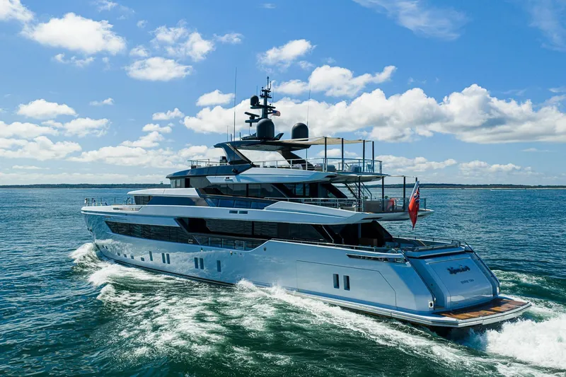 Neverland Yacht Photos Pics Luxurious 2020 Sanlorenzo 44 Alloy yacht cruising on open water under a clear blue sky.