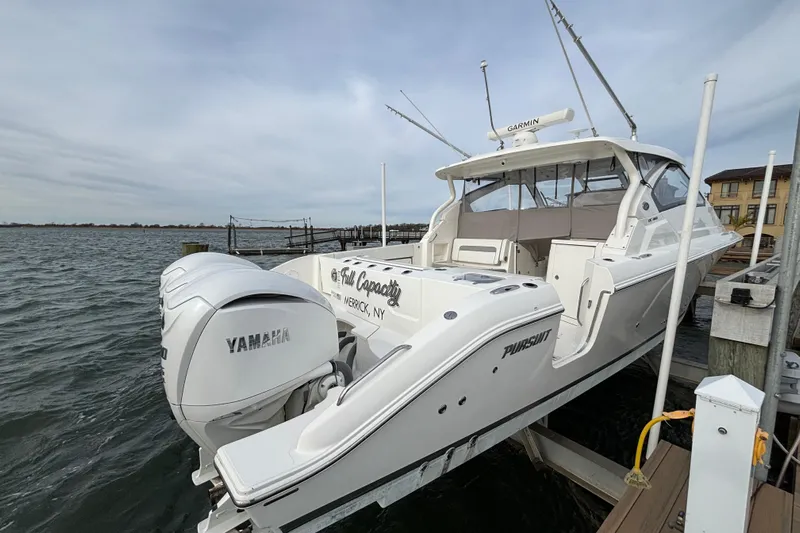  Yacht Photos Pics 2022 Pursuit DC 365 Dual Console boat docked with Yamaha engines.