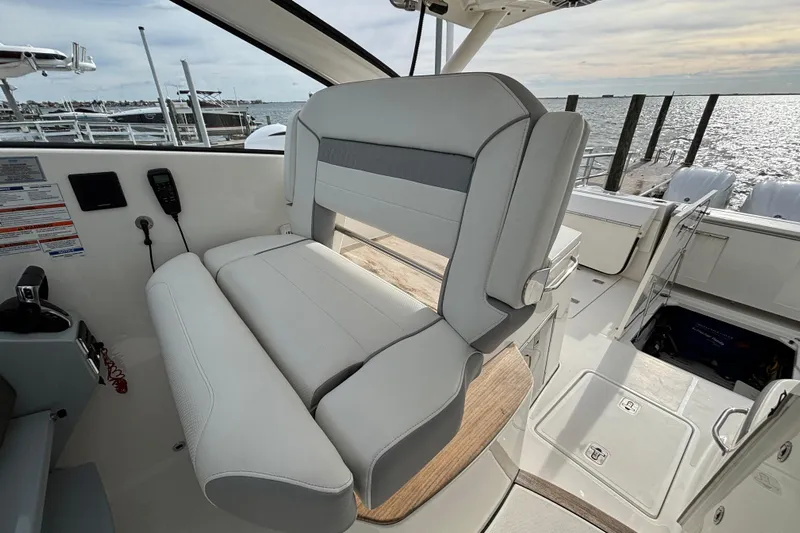  Yacht Photos Pics 2022 Pursuit DC 365 Dual Console boat interior with luxurious seating and ocean view.