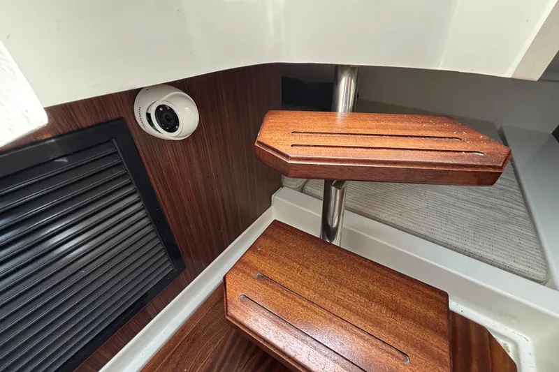  Yacht Photos Pics Interior of 2022 Pursuit DC 365 Dual Console with wooden steps and security camera.