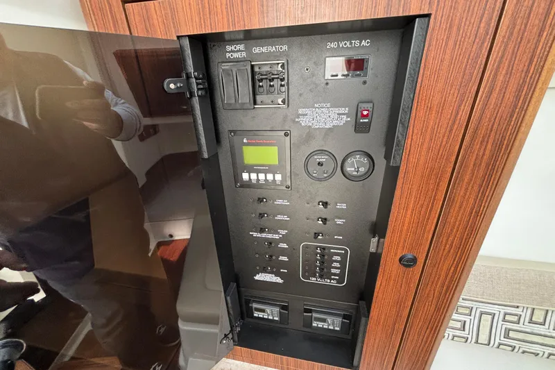  Yacht Photos Pics Electrical control panel on a 2022 Pursuit DC 365 Dual Console boat.