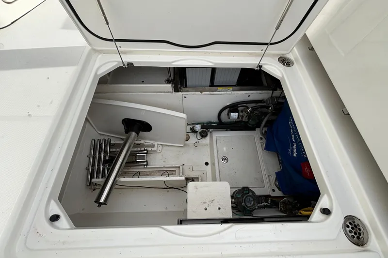  Yacht Photos Pics 2022 Pursuit DC 365 Dual Console storage compartment with equipment and accessories.