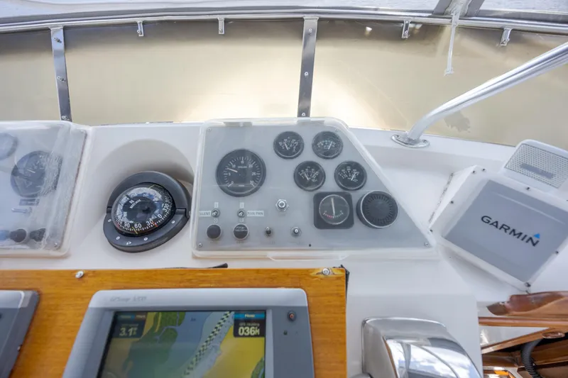  Yacht Photos Pics Dashboard of a 1989 Offshore Yachts 48 Yachtfisher with navigation instruments and Garmin display.