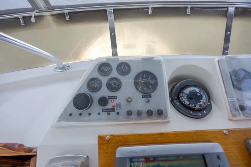  Yacht Photos Pics Control panel of a 1989 Offshore Yachts 48 Yachtfisher with gauges and compass.