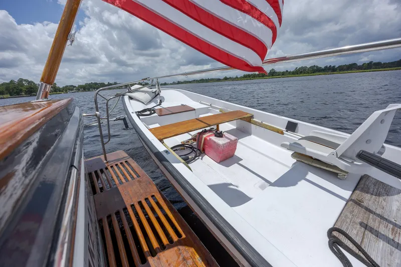  Yacht Photos Pics 1989 Offshore Yachts 48 Yachtfisher on water, featuring deck and American flag.