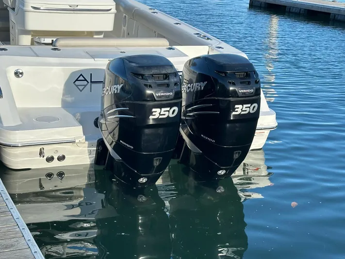  Yacht Photos Pics 2017 Boston Whaler 330 Outrage with twin Mercury 350 engines docked in water.