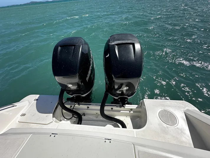  Yacht Photos Pics Boston Whaler 330 Outrage 2017 with dual outboard motors on open water.