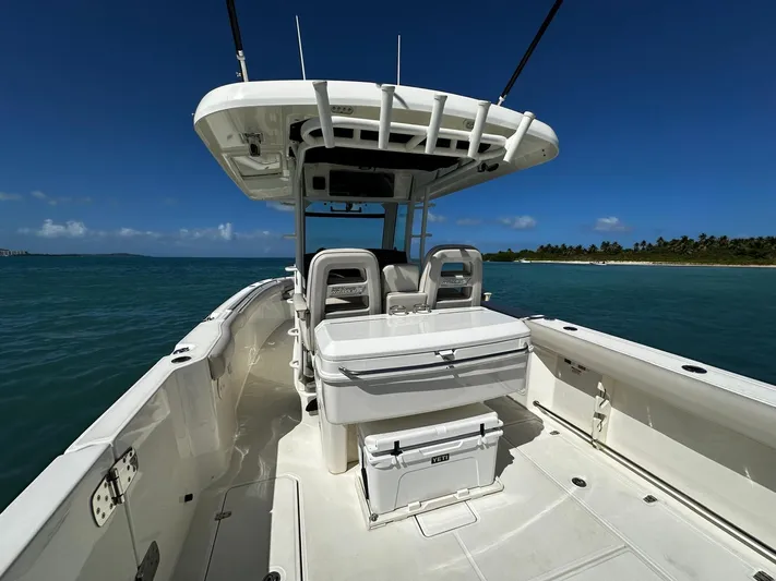  Yacht Photos Pics 2017 Boston Whaler 330 Outrage boat on clear blue water, sunny day.