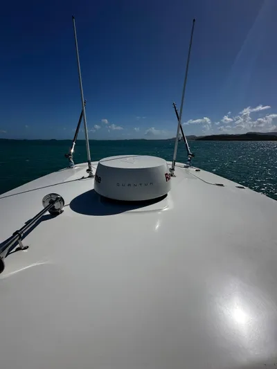  Yacht Photos Pics 2017 Boston Whaler 330 Outrage boat on open water under clear blue sky.