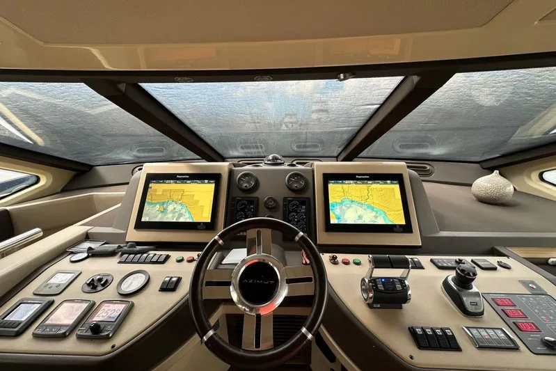 No Name Yacht Photos Pics 2017 Azimut Fly yacht cockpit with advanced navigation systems and modern controls.