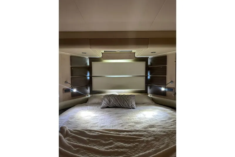No Name Yacht Photos Pics Luxurious bedroom interior of 2017 Azimut Fly yacht with modern lighting and cozy bedding.