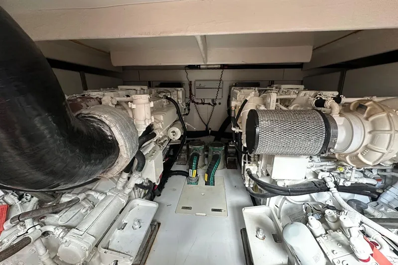 No Name Yacht Photos Pics Engine room of 2017 Azimut Fly yacht, showcasing dual engines and mechanical components.