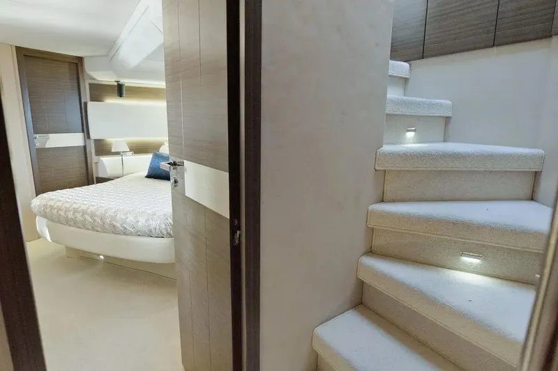 No Name Yacht Photos Pics Luxurious interior of 2017 Azimut Fly yacht with elegant bedroom and illuminated stairs.