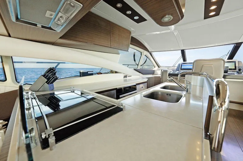 No Name Yacht Photos Pics Luxurious interior of 2017 Azimut Fly yacht with modern kitchen and ocean view.