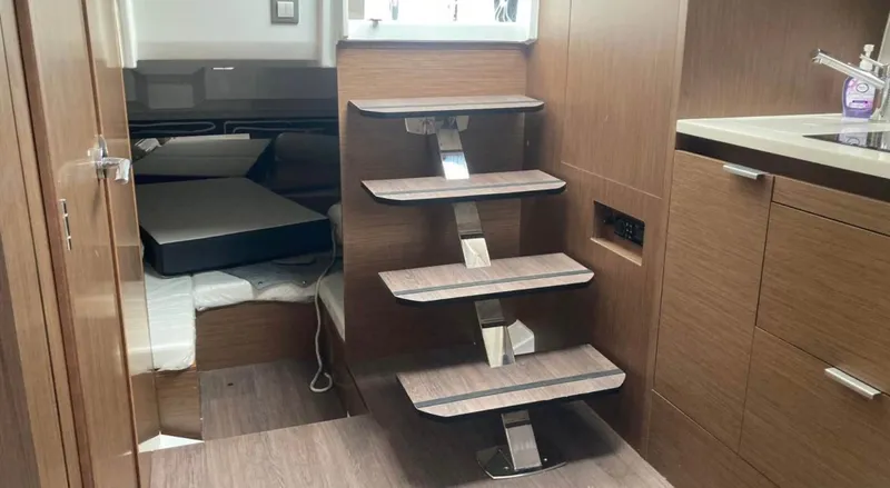  Yacht Photos Pics Interior of 2022 Jeanneau Leader 10.5 WA Series 2 with modern wooden stairs and cabin.