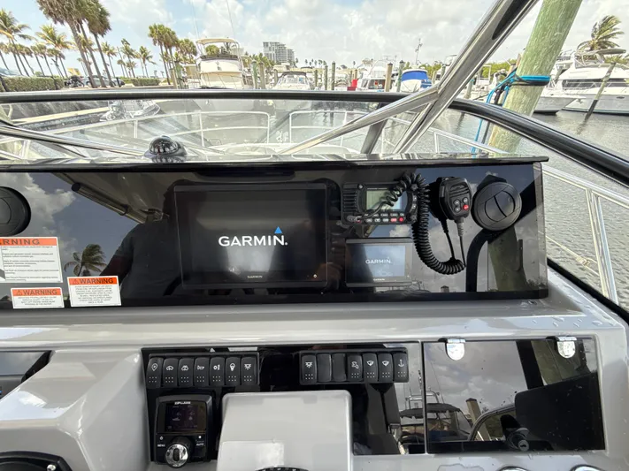  Yacht Photos Pics Control panel of 2022 Jeanneau Leader 10.5 WA Series 2 with Garmin navigation system.