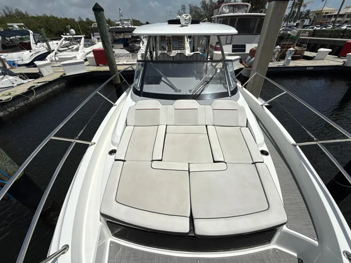  Yacht Photos Pics 2022 Jeanneau Leader 10.5 WA Series 2 boat with spacious sunbathing deck at marina.