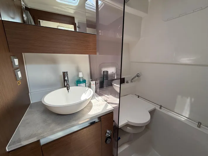  Yacht Photos Pics Modern bathroom in 2022 Jeanneau Leader 10.5 WA Series 2 boat, featuring sleek design.