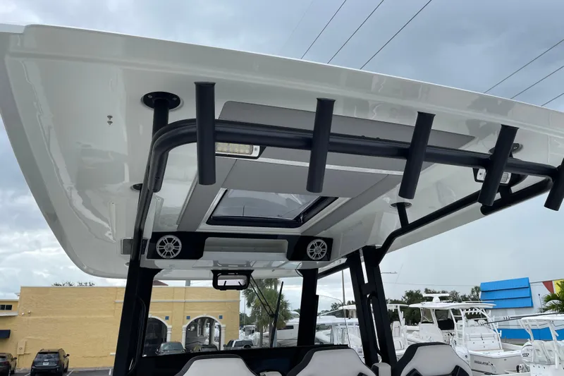  Yacht Photos Pics 2024 Jeanneau Leader 10.5 CC boat with sleek roof design and rod holders.