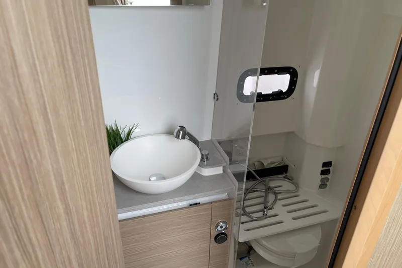  Yacht Photos Pics 2024 Jeanneau Leader 10.5 CC bathroom with modern sink and compact design.