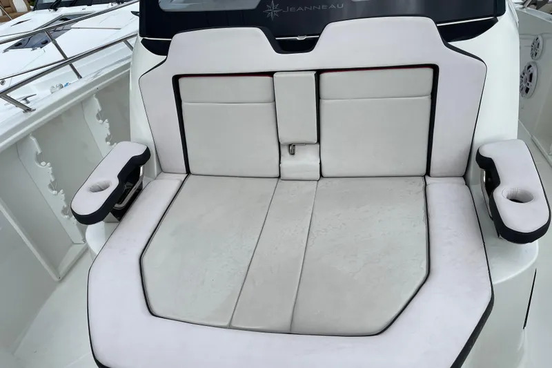 Yacht Photos Pics 2024 Jeanneau Leader 10.5 CC boat seating area with cushioned armrests.