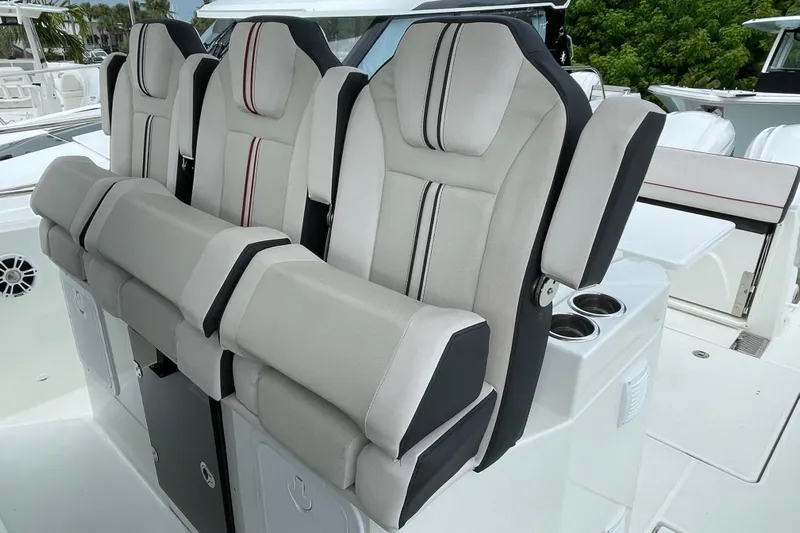  Yacht Photos Pics 2024 Jeanneau Leader 10.5 CC boat seats with modern design and cup holders.