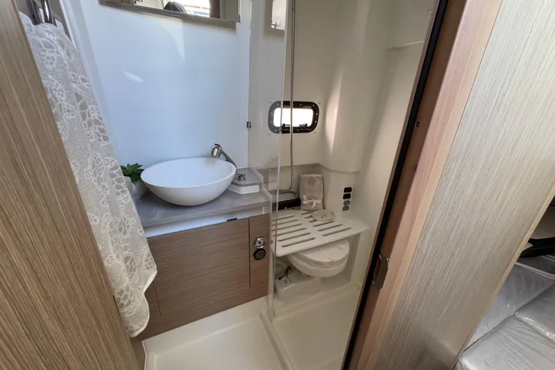  Yacht Photos Pics 2024 Jeanneau Leader 10.5 CC bathroom with modern sink and shower.
