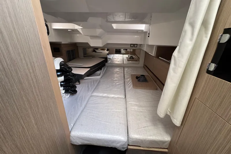  Yacht Photos Pics 2024 Jeanneau Leader 10.5 CC cabin interior with modern design and comfortable seating.