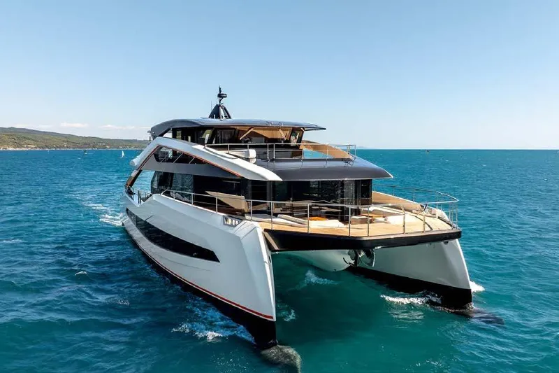 Acali Yacht Photos Pics 2024 Widercat92 luxury yacht cruising on open sea, showcasing sleek design and spacious deck.