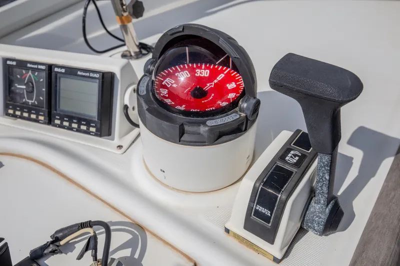  Yacht Photos Pics Compass and controls on a 1999 Beneteau Oceanis 44 CC sailboat.