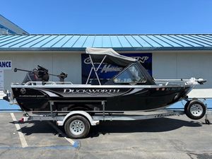 2023 Duckworth 18 Advantage Sport boat on trailer, parked outdoors under clear blue sky.