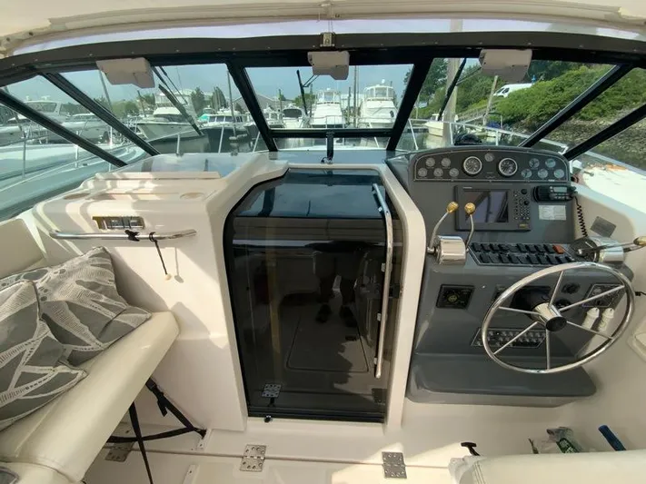 Vixen Yacht Photos Pics Interior of 2002 Tiara Yachts 3500 Open, helm and seating area.
