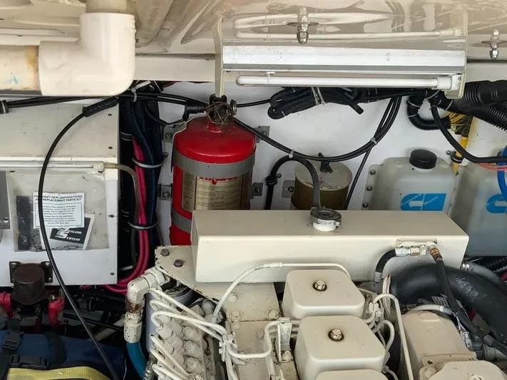 Vixen Yacht Photos Pics Engine room of 2002 Tiara Yachts 3500 Open with fire extinguisher.