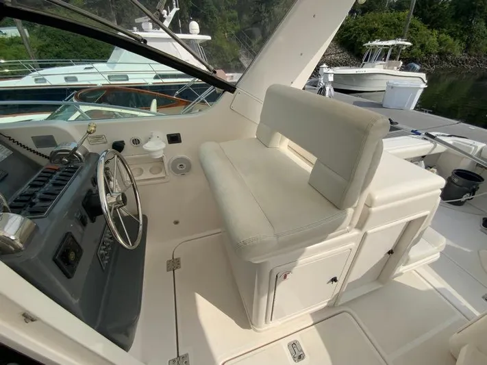 Vixen Yacht Photos Pics Interior of a 2002 Tiara Yachts 3500 Open, helm and seating area.