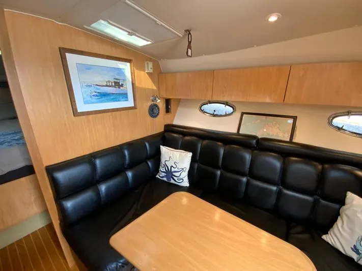 Vixen Yacht Photos Pics Interior of a 2002 Tiara Yachts 3500 Open with leather seating.