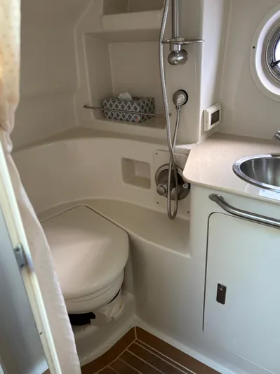  Yacht Photos Pics 2012 Sea Ray 350 Sundancer bathroom with toilet, sink, and showerhead.