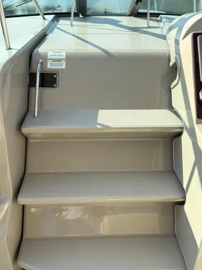  Yacht Photos Pics Stairs on a 2012 Sea Ray 350 Sundancer boat, featuring sleek design and metal handrails.