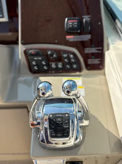  Yacht Photos Pics Control panel of a 2012 Sea Ray 350 Sundancer boat with throttle levers.