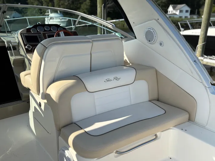  Yacht Photos Pics 2012 Sea Ray 350 Sundancer boat interior with beige and white seating.