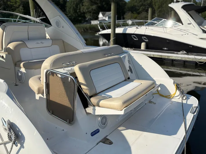  Yacht Photos Pics 2012 Sea Ray 350 Sundancer boat with beige seating at a marina.